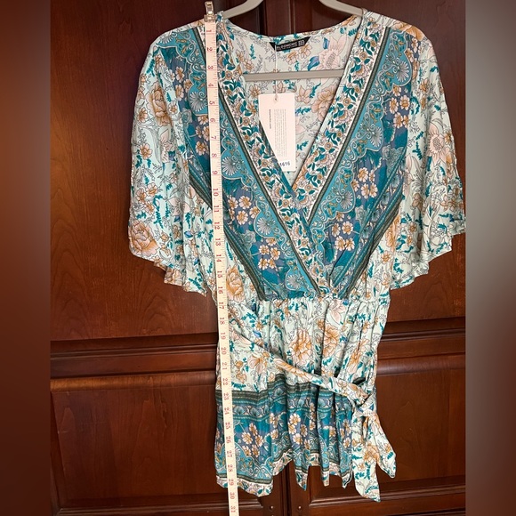 Beautiful BloomChic teal bandana print top with flutter sleeves and a tie belt. - Picture 7 of 7
